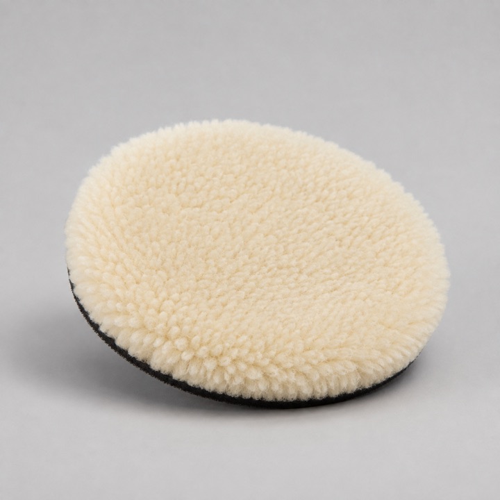 AI-generated close-up of a generic wool polishing pad showing its dense short fibres